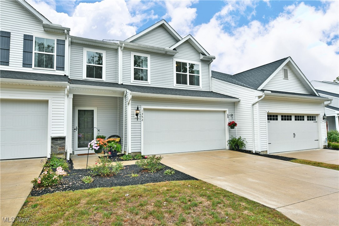 Located on a convenient and private street in Forest Lakes Development, this 3 bedroom 3 bath Townhouse built in 2021 has all the "Extras". The exterior is tastefully landscaped both in the front and back creating a natural privacy. As you enter the front foyer, the appealing guest bath and trendy converted closet will please you. Then to the Great Room featuring high ceilings, custom built wall with elegant electric fireplace and mounted TV, recessed lighting, and vinyl flooring throughout the first floor. The stunning eat in kitchen offers the breakfast bar, gorgeous granite countertops, tiled backsplash, cabinet undermount lighting, and all stainless steel appliances. The dining area with sliding glass doors overlook the oversized 10 X 25 patio with another dining area, as well as grilling and sitting area. Back inside on the second floor is the spacious master suite featuring the warm and inviting corner fireplace, large walk in closet, and beautiful bath with tiled shower and frameless glass door. Two additional bedrooms, second full bath, and convenient laundry room complete this floor. Another update is all new upscale light fixtures throughout. And on the first floor through the kitchen is access to the newly finished drywall and painted garage. Also, the ceiling recessed racks are easily accessible for plenty of storage. Forest Lakes takes care of lawn and snow removable and offers residents use of the community park, playground, pavilion, and walking trail. Hurry on this one, it won't last long!