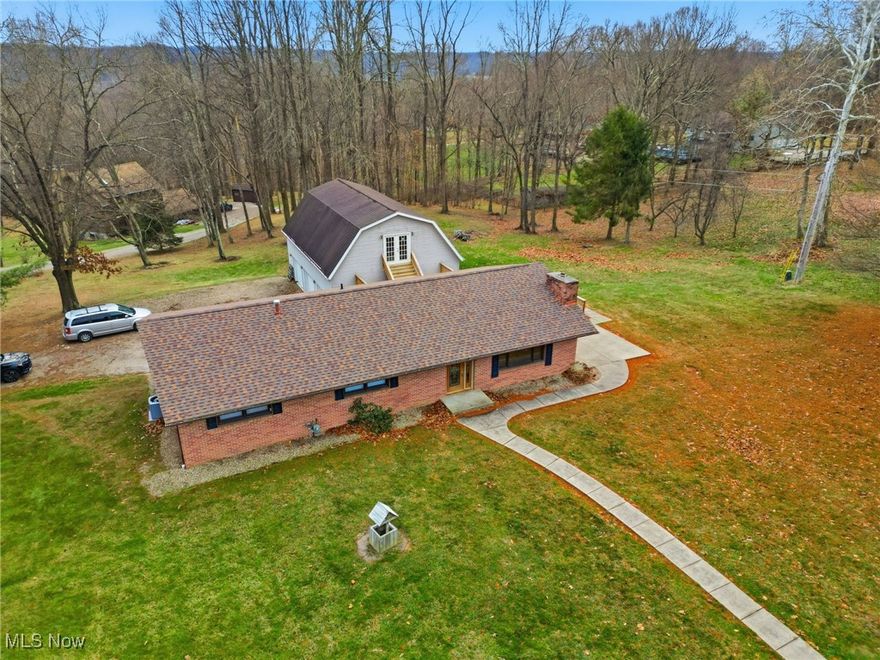 Brick ranch with walk out basement.  Open concept living room with fireplace, nice patio and newer rear deck off of the living space.  Rear deck leads to the upper level of the detached garage that can create additional living space.  2 car built in garage as well as an additional 30x40 detached 3 car garage.  2 lots that create a park like feel.