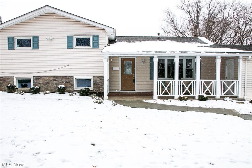 This wonderfully remodeled home shows just like new!  So many updates have been done here.  This super floor plan features a very spacious living room with beautiful wood flooring, an awesome kitchen with new kitchen sink and faucet, cabinet hardware, back splash,  ceramic tile flooring and newer range and dishwasher.  Newly added family room in the lower level plus new full bath in lower level.  Three bedrooms and full bath on second floor.  A welcoming and relaxing covered front porch has new railings.  New leaded glass panel front entry door.  Nestled in a convenient, private setting close to shopping and dining.  A truly lovely home!