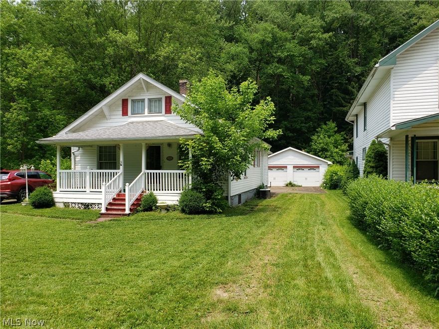 Curb appeal and a 4 car garage ALL for $49,000! Cute 2 bedroom 1 bath home with oak kitchen and first floor laundry. Fuel oil furnace and Air Conditioning. Bathroom and upstairs bedroom has electric baseboard heat and Propane tank was used for a fireplace that is no longer in home. Water softener was leased but is no longer in use. This home has 2 level lots just outside of village limits.
