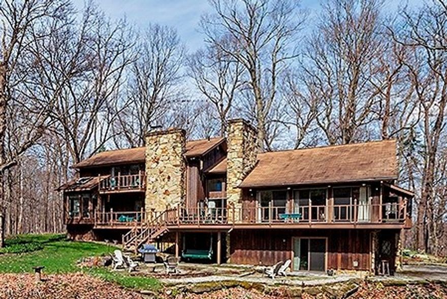 Progressive Reserve Auction (Not a live auction). NO EXTRA BUYER FEES! SUBMIT OFFERS NOW! Auction date is deadline for bids which are reviewed daily. Seller may accept an offer at any time. List Price is the Suggested Starting Bid. Custom Cedar & stone built home situated on a 5 acre serene wooded setting. Property is inside the Cuyahoga Valley National Park. Boasting nearly 5000 SF this home features huge vaulted Great rm w/wood paneled beamed ceiling, skylights & a hand crafted floor to ceiling stone wood burning fpl. Huge wraparound Deck w/built in grills overlooking  LL sandstone Patio. Huge Kitchen w/center island & Dinette that leads to the 4 season Sunroom. Master suite w/sitting area his/her walk in closets, fpl, glamour bath w/garden tub & double vanity. 2- 1st floor guest suites w/beautiful views one has a private deck. Full partially finished bsmt w/spacious Rec Room.  2 car attached garage that has an access door to the basement, suitable for 6 additional cars.