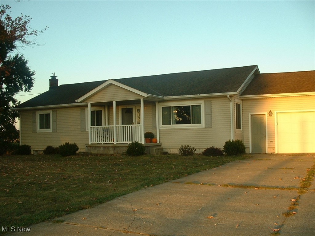 Nestled amidst sprawling farms and endless corn fields, this ranch home on just under 1 acre was lovingly cared for by the same owners for over 38 years. It features 3 good sized bedrooms, a recently updated full bathroom, a spacious living room, eat in kitchen, newer appliances, carpet thru-out recently replaced, partially finished walk out basement with family room, possible 4th bedroom, 2nd full bath, workshop area and lots of shelving and storage. Should water be your interest, there is a large above ground pool with decking and a nearly new cover. It also has a self propelled vacuum. Up a few steps is a 12x36 covered deck providing space for lots of outdoor activities. In addition to the attached 2+ car garage, there is a detached 1 car garage/workshop with 220. If country living beckons, this just may be your opportunity to make this your new home. (Property does qualify for USDA financing)