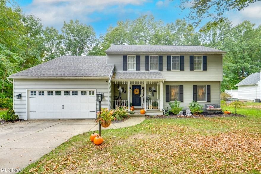 Beautiful colonial home situated on a wooded lot in Revere School District!! You’ll immediately appreciate the warmth and updates the second you walk through the front door and are welcomed by the gorgeous and inviting living room with updated dark and rich wood floors.  The living space flows nicely to the elegant and spacious dining room. The updated and roomy kitchen includes all of the must haves - all stainless steel appliances, white cabinetry offering ample room for storage, granite counter tops, gorgeous tile back splash and an additional dining area attached! From the kitchen you’ll enter into the family room which features vaulted ceilings, a fireplace, and access to the gorgeous wooded backyard setting which includes both a deck and beautifully designed patio with built in fire feature. Upstairs you will find 4 bedrooms including a Master Bedroom with a roomy en suite bath including a walk in tile shower.  The 3 additional bedrooms are a great size and there is another updated full bathroom with wonderful skylight. You will not want to miss out on this opportunity to own a home in one of the most desirable areas around!