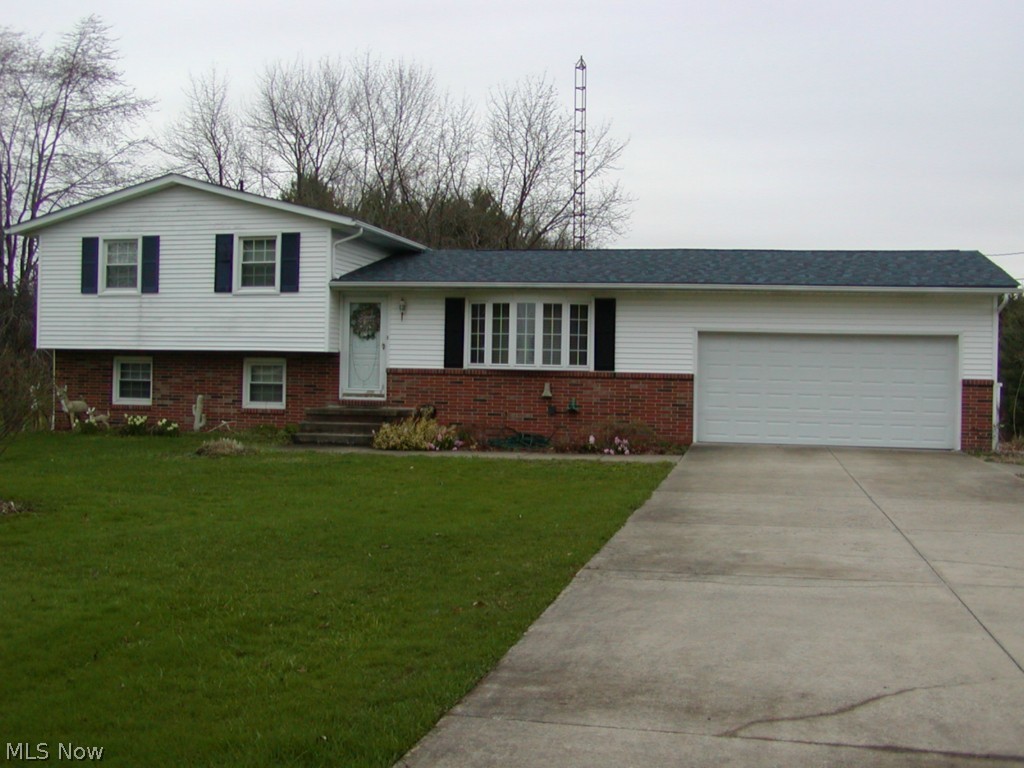 Lot 223 X 1025. EASY TO SHOW!! Roomy 4 bedroom two bath 4 level split with many updates. New septic installed Sept. 2015 per Portage County requirements. .Roof 2013, HW Tank 2/14/15, Champion replacement windows, garbage disposal 2012, built in microwave 2015, Family room with glass doors to covered patio, Two car attached garage plus extra two car garage. Wide paved drive with extra parking plus turn around. Seller now receives $200 to $300 per year for oil rights that will stay with the new buyer. Seller does not guarantee the amt. or how long it will last. Special assessment is $9.23 for storm water district and it is continuous. America's Preferred HW included. Pre-appraised VA , call agent for info.