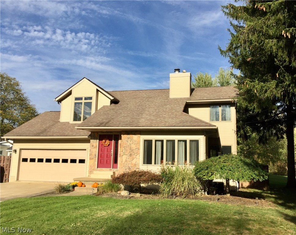 An absolutely stunning contemporary on almost an acre in Tallmadge. This 3 bed, 2 1/2 bath home has a wide open concept. The large great room features a beautiful stone fireplace. A large center island sets off the eat in kitchen with granite counter tops and stainless steel appliances. A 25x13 rec room is set up in the finished lower level. A master suite highlights the large bedrooms. The gorgeous rear yard is partially privacy fenced, and has a deck and patio! There is a two car garage, ample storage, a laundry room, and so much more.