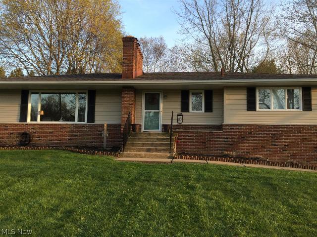 Fantastic find in Springfield Twp. This gorgeous home offers a park like setting with its .82 acre lot and beautiful mature trees. It is in pristine condition with a 2.5 attached garage, 2 wood burning fireplaces, 3 bedrooms which all have new carpet, 2 full baths and a finished lower level with a handcrafted bar. An open floor plan with beautiful large picture windows that allow tons of natural light to shine. This well kept home includes all appliances. It is freshly painted throughout and has all new blinds. New roof, siding and gutters Sept 2007. Furnace Nov 2009. Water softener Jan 2012. An amazing 15x30 stamped patio Aug 2014. This home is move in ready and definitely a must see!!