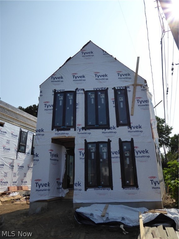 Currently under construction! Contemporary 3 bedroom home custom designed by award winning Horton Harper Architects with 15 year tax abatement! This spacious three bedroom two and ½ bath home includes a huge master suite with enormous walk-in closet and spacious bath with double vanity with quartz counters and large tile shower. Light-filled living area with very tall floor to ceiling windows, engineered wood flooring and open floor plan. Ceramic tile in baths, quartz kitchen which includes stainless steel oven/range, dishwasher, microwave and refrigerator. The unique angles, dark lapped hardiboard siding, and tall black windows give the home a very distinguished look. The detached rear 2-car garage leaves enough room for yard space or a nice patio. Other features include, a bedroom level laundry room, mud room off of the back yard and roughed in plumbing for a future basement bathroom Built to Enterprise Green Standards. Great Franklin Blvd location steps to the restaurants and entert