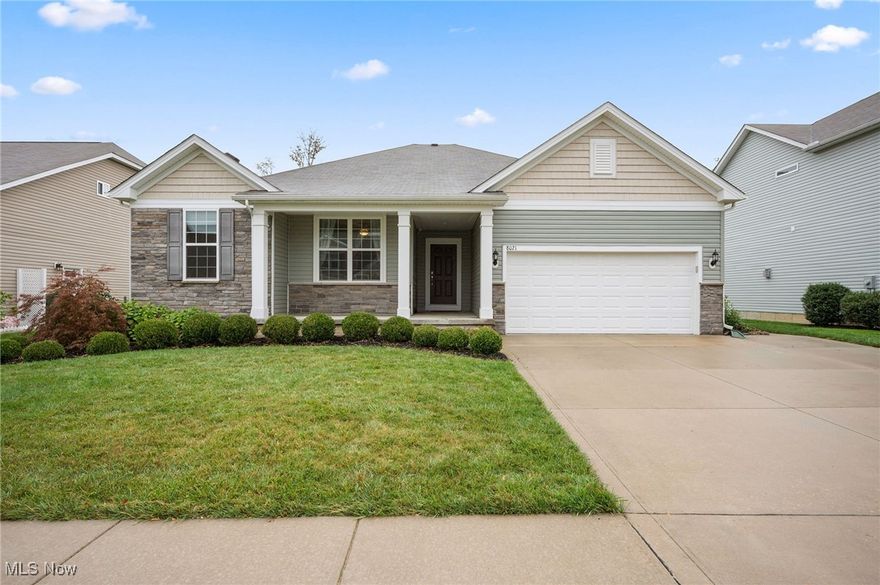Beautiful west facing Amberwood style ranch home, lovingly maintained by the original owners, featuring numerous thoughtful updates and premium builder upgrades throughout. Three main level bedrooms including the main bedroom with attached full bath plus walk in closet, and a lower-level bedroom. Additional full bath in lower-level, and main level has another full bath and half bath. Laundry is on main level between great room and garage. Recent owner improvements include granite countertops, updated flooring, a fully finished basement, and a charming brick patio with custom steps, and carpeting with memory foam padding. A newly added large kitchen window fills the open floor plan with natural light. Builder upgrades abound, including elegant Landen recessed-panel maple cabinetry with soft-close doors, dovetail drawers, and undermount hardware; extra recessed lighting in both the bedroom and living room; a convenient pedestrian side door leading to a concrete walkway and widened driveway pull-off; and a cozy gas fireplace with a direct vent, upgraded hearth, and handsome Roxborough mantle.