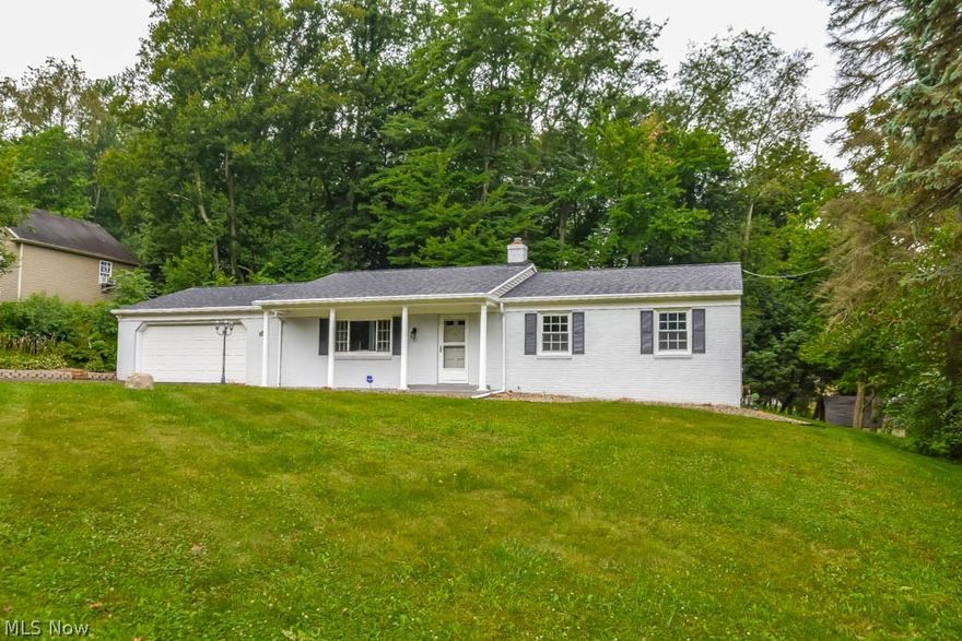 Move-in ready 3 bedroom, 2 full bath brick ranch on .7 acres! Crack open your cookbook in the updated kitchen with stainless steel appliances, newer cabinets and a breakfast bar! It opens to a dinette with sliding glass doors to the back deck. Gather in the spacious living room with a picture window. Down the hall, there are 3 bedrooms and a large full bath with double vanities, laundry chute and tile shower surround. There’s a second full bath with a walk-in shower by the garage entrance, very convenient for cleaning up after working outside. 2-car attached garage with a back garage door - great for lawn equipment. Freshly painted lower level offers a huge utility room for storage plus a 25x17 possible rec room. Nice, wooded backyard with room to run and play. Schedule a private showing today!