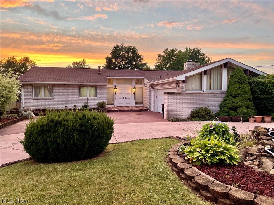 Step into Hollywood Glam with this very unique, custom designed house. As you walk in the front door, you'll see this is no cookie cutter home. Beyond the tile entryway with cathedral ceilings, you'll step down into the large sunken living room. The first floor features a huge kitchen and seating area with a stone fireplace & a separate dining room with hardwood floors. The master suite has built in furniture, a custom mosaic above the sunken tub and bathroom with bidet. The closet/storage space will amaze you. There are 2 more bedrooms and a bath on the first floor. Then downstairs you walk into a dance room/bar area next to a second living/family room with fireplace. There are 2 more bedrooms on this level--one currently being used as a sewing/craft room has 2 walk in closets. The whole back of the house has abundant windows and sliding doors looking out over the back yard and inground pool. Don't let the outside fool you--this home is huge!