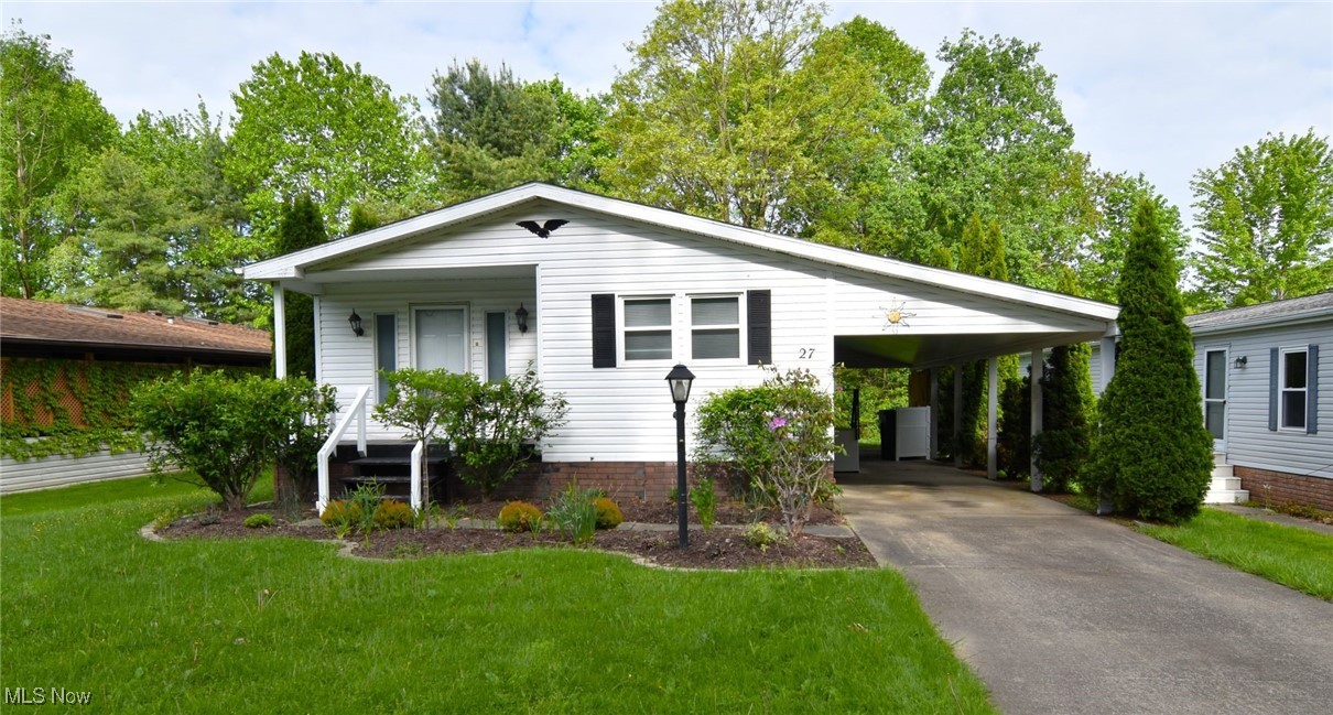 Watch the world go by from the front porch of this nicely updated ranch home, tucked away in the wonderful Troy Oaks Community. This home offers an open floor plan with vaulted ceilings and newer flooring throughout (2024). The light and bright living room opens to the dining area which is just off of the kitchen. The primary bedroom features a remodeled (2024) en-suite bath with walk in shower. The 2nd bedroom features access to a 2nd remodeled (2024) full bath also accessible from the hallway. A conveniently located laundry room leads to the side patio and carport. Covered patio overlooks the private backyard with newer storage shed (2024). Many updates:HVAC, Flooring, Bathrooms, Hot Water Heater, Windows, Closet Doors, Front Porch, Shed, Washer and Dryer all updated in 2024. This home is located near the LaDue Reservoir and has convenient freeway access.