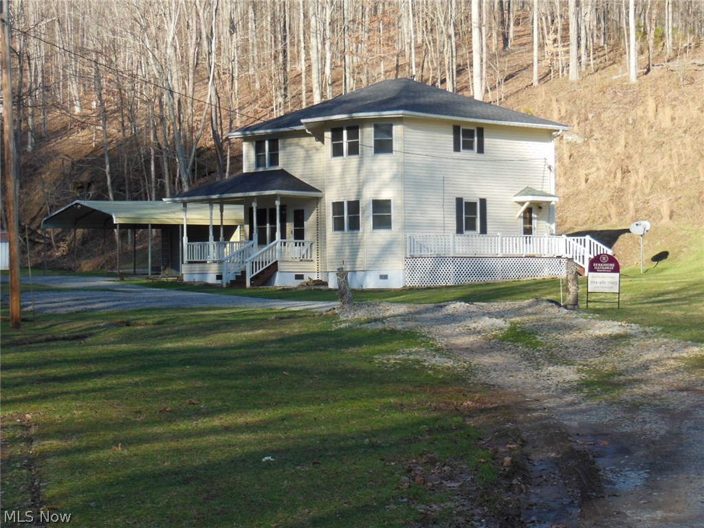 This charming 2-story is tucked away in a quiet, serene valley setting and offers nearly 40 acres with abundant wildlife plus a bonus of FREE GAS per owner. There is a small stream through the property, a little bottom land, and the balance hilly and wooded. A generator powers nearly all the house during a power outage, ample car storage with two double detached carports, one with heated storage room behind plus an additional storage building. Newer updates include: Central A/C , side deck, flooring in the MBR and stairway, ceiling fans, SS fridge & dishwasher, water filter & softener, French drains, and gutters. Septic was pumped in 2016. Gravel road from Rt. 47 is usually graveled by the oil company that maintains the gas well.