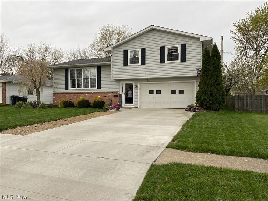 Beautifully updated split level, new windows throughout, newer flooring, sliding doors from dining lead to the two tiered deck.  Also a covered patio off the garage. spacious fenced in yard with fire pit area great for entertaining. All appliances in the kitchen stay with the home.  Brand new driveway and porch.