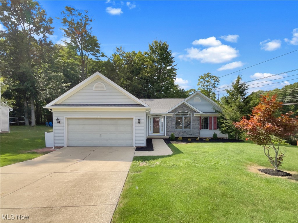 Nestled on a quiet cul-de-sac in Twinsburg’s sought-after Glenwood Preserve community, this beautiful 4 bedroom, 3 bath ranch offers spacious single-level living with thoughtful updates throughout. The open floor plan features vaulted ceilings, new flooring, updated lighting, and neutral finishes that create a warm and inviting atmosphere. The room showcases a cozy fireplace with built-ins, flowing seamlessly into the kitchen and dining areas for easy entertaining. The primary suite boasts a large walk-in closet and a luxurious bath with a separate shower and jetted tub. The finished walkout basement adds incredible versatility, offering a spacious rec room, a 4th bedroom, and a full bath—ideal for or multigenerational living. Outside, enjoy a large private fenced yard with a deck perfect for gatherings and outdoor relaxation. With its prime location near parks, schools, and amenities, this home combines comfort, style, and convenience in one exceptional package.. 100-Day Home Warranty coverage available at closing