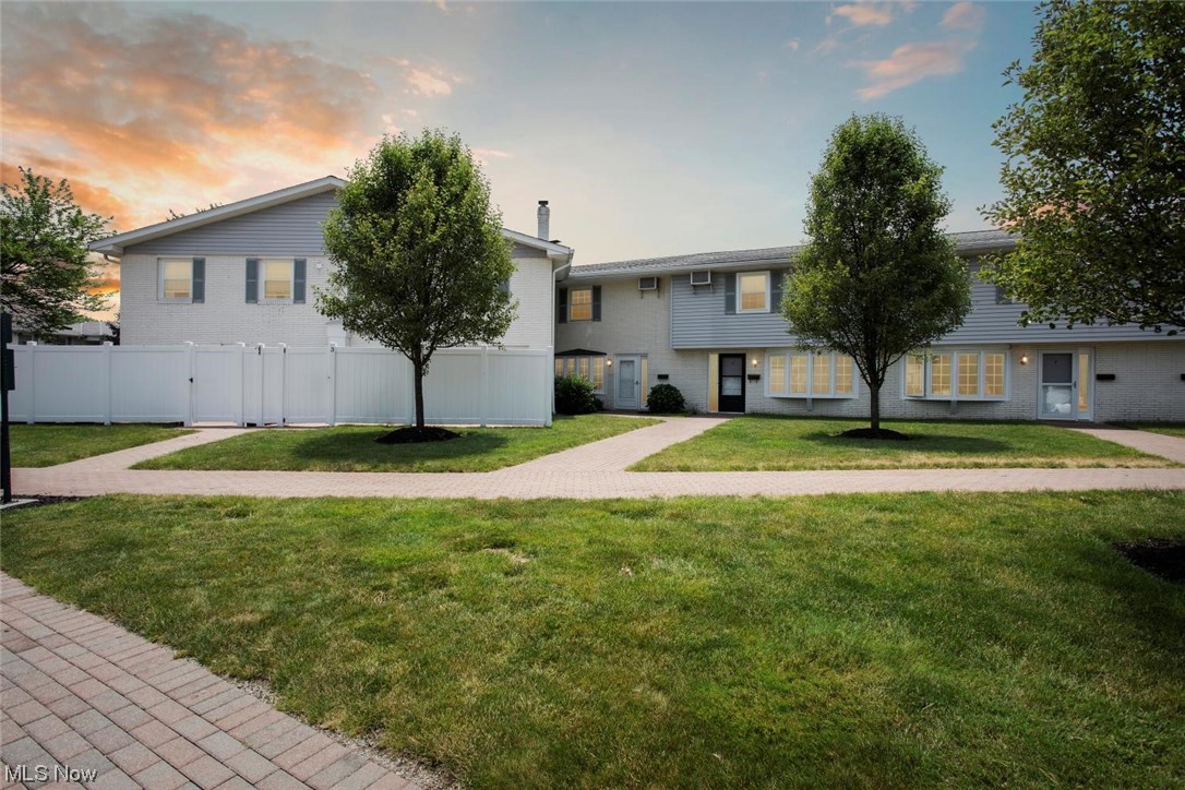 Welcome to the community that offers care-free living and lots of fun. This unit is unique, it has great views of the pond, 4 bedrooms upstairs with highly desirable hardwood floors and 1.5 bathrooms with a laundry in the unit. Enter into a two-story foyer with a famous curved staircase and slate floors. Sun-filled living room boasts a wood burning fireplace and expansive bay window with extra insulation. Oak floors in the living room are newer and can be re-done 2 more times. A formal dining room has a door to a gorgeous fenced patio big enough for entertaining guests and growing your favorite plants. Eat-in kitchen was updated about 10 years ago. Refrigerator and stove are 3-5 yr old. 2 bedrooms have walk-in closets. You can access a bathroom with a walk-in/sitting jacuzzi from both the hallway and master bedroom. Wall AC is installed in the closet and ductwork is leading to every room upstairs. Electrical outlets and switches were updated in 2023. You will like to find nature stone
