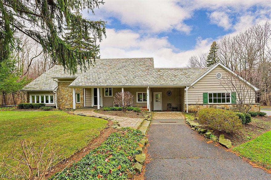 Charming Gates Mills country home with custom designed renovations and versatile use of space. Beautiful addition with separate entrance on 1st floor. Can be used as first floor master suite (w/exceptional private bath), home office w/private waiting area, art/yoga/dance studio, exercise room/gym, showroom... whatever suits your at home needs.......unlimited possibilities. Beautiful Somrak kitchen that opens to a gorgeous family room w/fireplace, gleaming wood floors and wall of windows. Paneled library with slate fireplace and bay window plus additional bedroom on 1st w/private entrance and own w/full bath. Second floor has two additional bedrooms and a state of the art bathroom with granite countertops, heated floor, and large walk-in shower. Can be used as master bedroom Has adjacent room for versatile use........Covered rear patio w/skylights overlooks 2 beautifully manicured and serene acres. Electric pet fence, outdoor lighting....so much more. Enjoy this special country retreat.