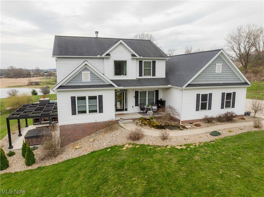 Nestled on over 5 acres, this exquisite 6/7bedroom, five bathroom residence offers an unparalleled blend of luxury and comfort. As you enter the main level, you're greeted by a gourmet kitchen with Corian counter tops, custom maple cabinets and two large pantries. The kitchen seamlessly flows into a spacious living room which has large windows that allow the natural light to flood the room along with a striking stone gas fireplace. The main floor has dedicated office with a closet perfect for remote work, study or even a 7th bedroom.  The main floor also has a lavish primary suite featuring a generous ensuite bath with soaker tub, separate shower, double sinks and walk-in closet.  Head up to the second floor, you'll find four well-appointed bedrooms with ample closet space, two pristine full bathrooms, and a conveniently located laundry room, ensuring ease of living. The fully finished basement serves as an entertainment haven with a cozy family room, a stylish wet bar, an additional bedroom, and a full bathroom. This level's walk-out design leads directly to an outdoor oasis, complete with a charming pergola, an inviting patio, a rejuvenating hot tub, and a custom-built outdoor fireplace, ideal for gatherings in any season. The property's exterior is equally impressive, featuring a pristine in-ground saltwater swimming pool that promises endless summer enjoyment. A spacious two-car garage provides ample storage and parking solutions. With its expansive acreage and thoughtfully designed living spaces, this home offers a perfect retreat from the hustle and bustle, while still providing all the modern amenities for a sophisticated lifestyle.