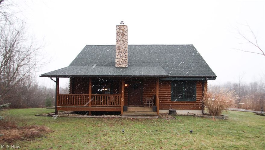 Beautiful and custom is this Barna Custom Built Log Home which is one of the most experienced and high quality log home manufacturers in the U.S. The open floor plan boasts vaulted open ceilings and loft area that showcases the quality of this timber home. The wood-burning stove and heated hardwood flooring thru-out the first floor, heats the home evenly. The custom built cabinets and island in kitchen add to the character of the home.  The first floor master bedroom boasts an updated bathroom with tile shower with glass door. Upstairs you will find the second bedroom, another full bath and a loft area that could be converted to a third bedroom if needed. Enjoy the convenience of a first floor laundry and additional kitchen storage with a built-in pantry. The full basement offers storage or additional living space potential. Enjoy coffee on the covered front porch, back deck or breezeway.