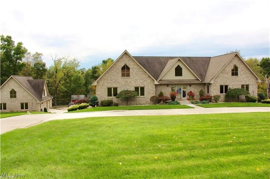 Stunning Classic. Visit this beautiful custom-built home nestled on 3.6 acres in the heart of Wintersville that offers approx 5,835 Sq Ft of finished living space. Perfect for entertaining inside and out; sparkling in-ground pool adjoins the 800 Sq ft outdoor sitting area featuring a full kitchen for preparing pool-side meals, a private putting green and separate fully functioning bath house complete with outdoor shower and restroom capabilities.  The 3 car detached garage complete with restroom and work space also offers approximately 700 sq feet of additional living space perfect for in-law suite, guest room or game room. The two car attached garage is spacious and immaculately clean. Inside, the well-appointed kitchen features granite counter-tops, built-in range and high-end appliances.  The spacious entertainment center contains a home-theater and full bar with plenty of room for parties and family gatherings. The complete exercise room downstairs beyond the soundproof doors offers convenience and style. The home is equipped with state of the art alarm system with cameras and features central Vacuum. Solid construction is evident throughout. Luxurious master suite and bath are just a few highlights of this 4 bedroom, 3 Full/2 Half Bath beauty. Pristine professional landscaping completes the outdoor paradise. This home is a must see.