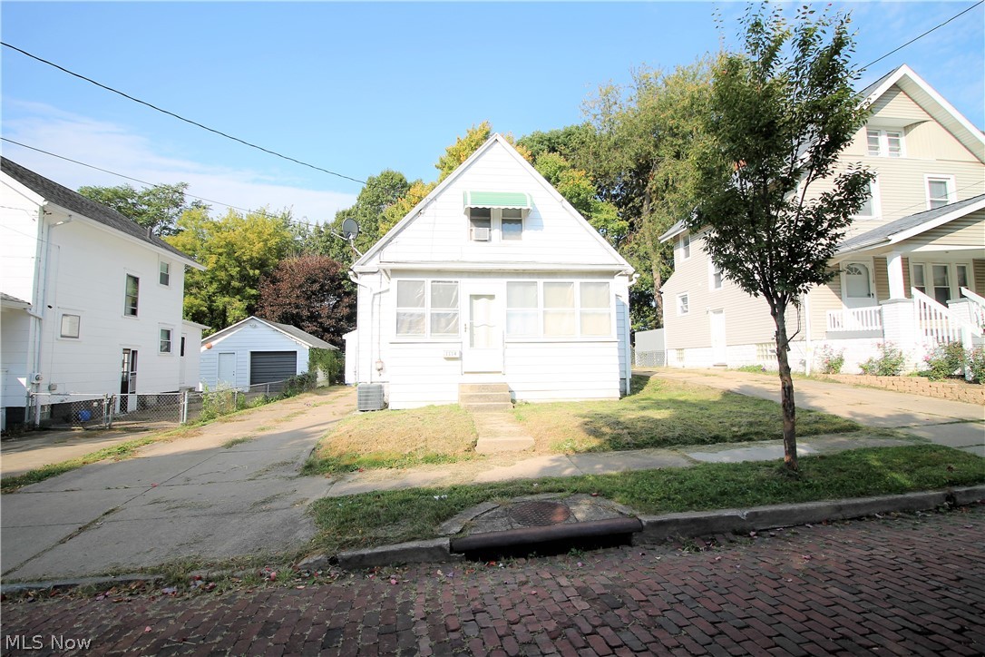 Endless possibilities! For investors or a great starter home! Cute and charming two bedroom, one full bath cape home. Come on in from the closed sunroom to the large living room, new flooring through out the home (2020), and freshly painted, dining room and the kitchen. This home has lots of windows throughout to let the natural light to shine through. The bright, cozy kitchen has freshy painted cabinets, lots of counterspace. There is an office or could be third bedroom on the first floor and full main bathroom. Upstairs you will find two large bedrooms. There is a clean full unfinished basement for storage etc. The backyard has mature landscaping and room for entertaining. There is a one car detached garage. Some updates include new vinyl replacement windows, new locks. So many precious memories begin right here!
