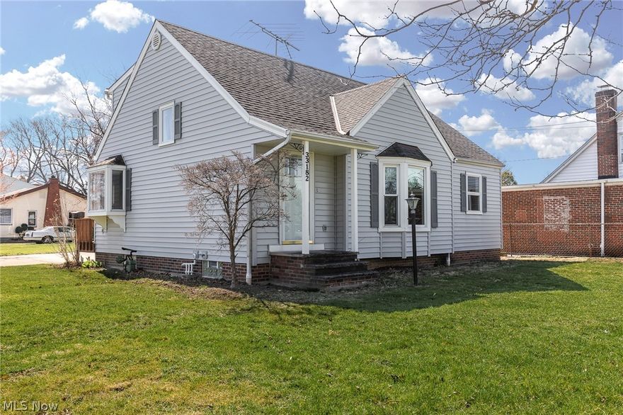 Beautiful updated 4 bedroom 2.1 bath bungalow-style home with all NEW carpeting (2020); all NEW laminate flooring (2020); all NEW bathroom vanities, lighting, hardware (2020); the entire home was just professionally painted inside in light grey and crisp white trim (2020); eat-in kitchen has cherry cabinets, NEW hardware, NEW countertops, NEW exhaust fan (2020), stainless steel appliances, built-in desk, dinette area with sliding glass doors to the deck for barbecuing; large living room with bay window; spacious foyer; two 1st floor bedrooms, half bath, 1st floor laundry room with direct access to the pantry, the side entrance to the deck, and the attached garage with pull-down storage; two large bedrooms, a full bath, a cedar closet, and built-in storage on the 2nd floor; and a full finished lower level with built-ins, a bar, an office/workshop, a full bath, a utility/storage room, and more!