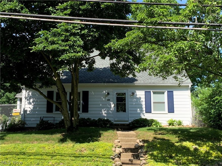 Neat Cape home, Well maintained with three bedrooms and 2.5 baths. Large L shaped family room with gas fireplace and patio doors leading to a covered porch. 2 car detached garage.