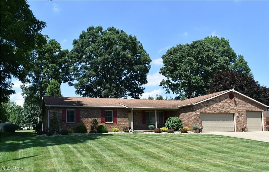 Custom built brick ranch with lush landscaping.Full lot sprinkler system. Attached 4 car garage. Newer Kraftmaid kitchen, granite counters. Spacious sun room out to trex/composite wood styled deck 15 X 24. Master bedroom suite with large walk-in closet, spacious jacuzzi bath, walk-in shower, office offset in master bedroom plus doors out to deck. Beautiful finished basement with family room with built-in bar, professional office, exercise room. Hobby barn 26 X 30 2 story. See attached photo with all the details. TAKE THE VIRTUAL TOUR, SO MUCH MORE TO SEE!!