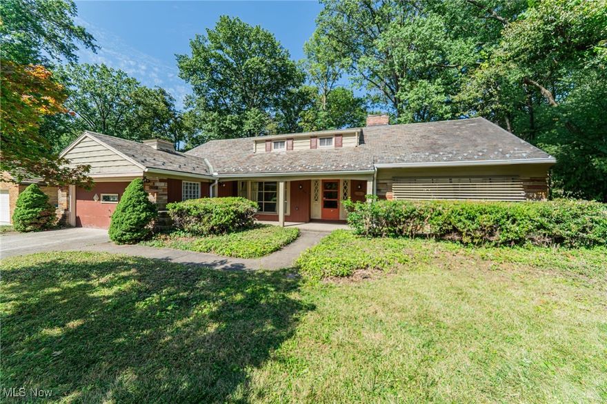 A true mid-century modern opportunity—big, bright, and brimming with upside. Crafted with premium-grade materials—slate roof, redwood siding, brick exterior—and warm interior finishes including hardwood floors and trim, this home sits on a larger-than-typical lot and pairs classic 1950s architecture with everyday contemporary convenience: two renovated bedrooms on the first floor (one a true primary), a generous foyer with a handy half bath, and a library/den/home office with built-ins. The large living room is anchored by a signature mid-century roman-brick fireplace with a wood-trim mantel and a broad bank of front windows; the elegant dining room opens to the enclosed back porch through a glazed wall with a full-glass door for effortless indoor–outdoor living; and the welcoming front porch offers plenty of room for casual seating. Upstairs continues the refreshed feel with a renovated bedroom at the west end and a renovated full bath. With three bedrooms up and two down, the layout delivers privacy and flexibility for guests, multigenerational living, or a quiet work-from-home wing. Downstairs, a finished, solid-wood-paneled recreation room adds a classic bar, a second fireplace, and space for a full pool table or home theater.

Approx. 2,850 sq ft above grade, plus ~1,350 sq ft below grade with ~560 sq ft finished (˜3,410 combined finished/usable space). Yes, the eat-in kitchen and first-floor bath need renovation—exactly where you’ll add the most value. Start at $299,000, bring your designer and contractor, and imagine the spectacular future: keep the mid-century modern lines, rework the kitchen hub, and elevate this home into a showpiece on a rare larger parcel with premium construction already in place. Opportunities like this don’t sit—see it now and claim the upside.