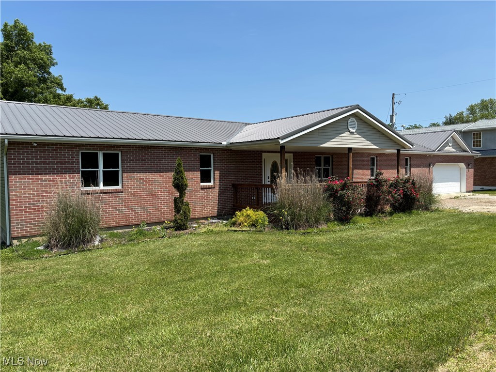 Welcome to the country if you are looking to get out of town. This expansive home is over 1800 sf of living space on the main level. The open concept of the living and kitchen space is large and just right for hosting family and friend. Check out the large wood deck that runs the length of the home with access right off the kitchen. The main level also offers three bedrooms and a first-floor laundry room. There are two full baths on the main floor. One is the master and has a garden tub and shower. If you ready to host a football game watch party lets, go the basement and check out the large family room complete with a wraparound bar, and lighting in place for your pool table. There is a third full bath in basement and a large fourth bedroom. There is a working home sauna the sellers will leave if wanted. Garage is an attached two car. There is an outbuilding in the back for even more storage or workshop space.