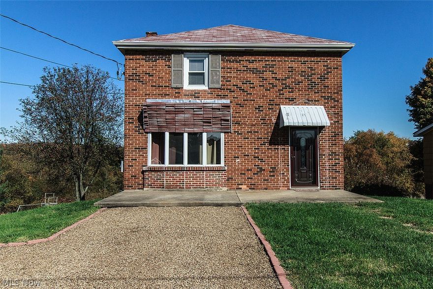 Three bedroom two bath home. Large living room. Full basement with wood burning stove. Extra large back yard.