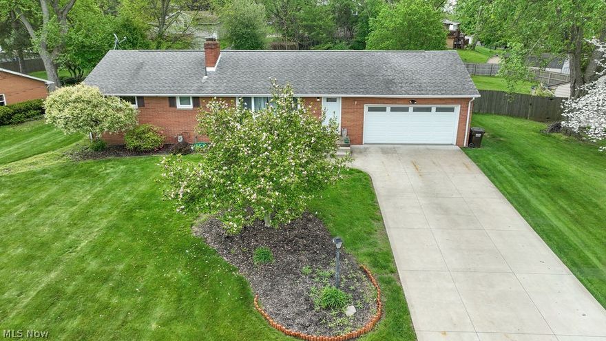 Welcome to this completely updated 3-4 bedroom brick ranch in Perry Township! Move-in ready and designed for modern living, the front door opens to a large, inviting living room featuring a cozy fireplace. The heart of the home is the fully updated eat-in kitchen, boasting Kraftmaid cabinets, sleek granite countertops, a stylish backsplash, a functional island, and a pantry.   The layout offers flexibility, with the master bedroom tucked away for privacy, while the additional bedrooms share a full bath down the hall. The 4th bedroom is currently utilized as a convenient main-floor laundry room. The vast, full basement includes a second full bath and offers endless potential to be fully finished.  The exterior is a private oasis, featuring a huge fenced yard perfect for entertaining, complete with an above-ground pool, deck, pergola, fireplace, and storage shed. Updates galore: Vinyl replacement windows (2020), plumbing/electrical upgrades, water softener (2023), water heater (2024), and HVAC (2018). Attached 2-car garage. Appliances convey—immediate possession!