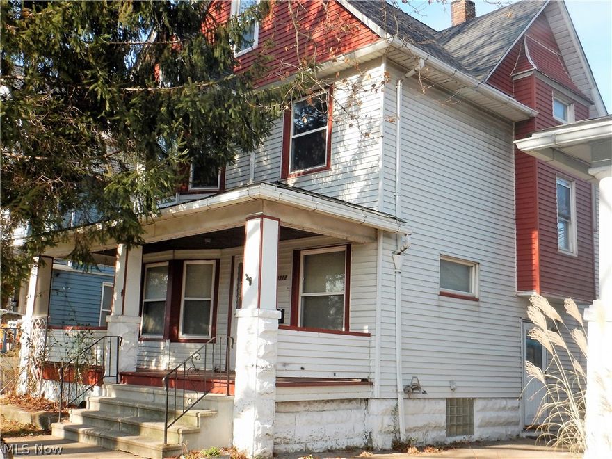 This classic colonial is a must see offering so much space and character! As you step on to the inviting front porch and open the beautiful wood front door with beveled glass, you will be wowed at the size of the living room, decorative fireplace, solid wood stair railing and original hardwood floors. The dining room features corner built-ins and a Pella sliding door leading out to a huge deck. An original wood swing door leads you to the eat in kitchen which is massive and updated with decorative tile backsplash and solid wood cabinetry. Upstairs are 4 nice sized bedrooms all with hardwood flooring and decorative woodwork. Full bath has been completely renovated with stunning tile work, jetted tub and modern cabinet. The easily accessible attic area is very large, insulated and can easily be completed into additional bedrooms or living space. Home features a tankless hot water tank, roof & furnace less than 10 years old, updated windows, blown in insulation, newer electric panel, and
