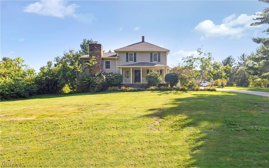 This is truly a special one!  Situated on over 2 acres. Every bit of this home has been redone from the original build in 1910.  Both front and side porches.  The eat-in kitchen has loads of dark wood cabinets and granite countertops.  Stove, wall oven, cooktop, dishwasher and microwave all stay.  Don't miss the half bath off of the kitchen.  There is also a separate formal dining room.  The main floor is perfect for big families or entertaining with a small intimate living room and a large family room with wood burning fireplace and wet bar.  There is a door in the family room that leads to a large deck and patio with outdoor fireplace.  Fantastic mudroom/laundry room on this level with loads of cabinet space and a full bath.  Upstairs you will find 4 spacious bedrooms and another full bath.  Lots of large windows for natural light.  The 3+ car garage is something to see. Built in 2006.  It is spotless inside.  Paneled walls.  A she-shed for all of your gardening tools and supplies.  There is an upstairs workshop area perfect for all your projects and hobbies.  Driveway was redone in 2007.  There is also another outbuilding for additional storage.  This yard has lots of room to roam.  There are even fruit trees!  Roof for house and outbuilding done in 2022.