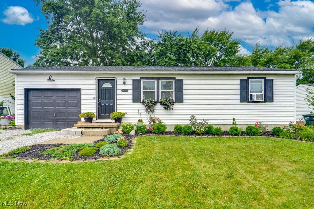 First-time homebuyers, or those looking to downsize - look no further! Welcome to this quaint, 2-bedroom, 1 full bathroom home in the quiet outskirts of Rittman, Ohio. This all-electric home has been refreshed with everything you could want. Enter through the front door into the open living room with plenty of room for relaxing after a long day's work. With plenty of natural light, the neighboring eat-in kitchen boasts lots of cabinetry and matching black appliances. The window opening gives the feeling of open concept living, without the commitment. For those looking for first-floor living, make your way down the hall to find the two bedrooms and full bathroom. Finally, step out back into your private, fenced oasis and enjoy the sunset on your attached deck or cozy firepit. With lots of green grass and beautifully maintained flower beds, this home is worth a look! Call your favorite Realtor today!