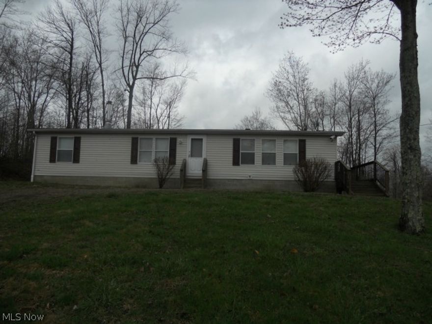 Manufactured home on 5.3 wooded acres. This 3 Bed/2 bath home comes fully furnished with the appliances and furniture that are currently in the home.The home sits on the front end of the property with the remainder being wooded acreage.