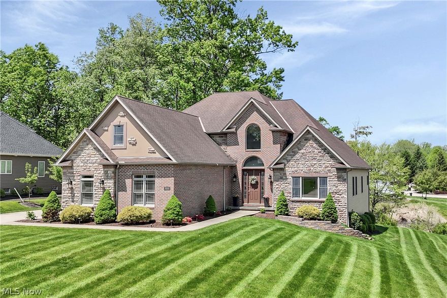 Prepare to be moved! Welcome home to 9000 Crooked Creek Ln, Broadview Heights, a spectacular 4-bedroom, 4-bathroom colonial located in the highly desirable Summerwood Estates. Boasting over 3,500 square feet of beautifully designed above-ground living space, this elegant brick corner-lot property blends timeless craftsmanship with modern luxury. Step inside the grand two-story entrance foyer, with Brazilian wood floors, to find an expansive floor plan featuring a dedicated first-floor office, a formal dining room, and an impressive living room complete with a cozy gas fireplace and soaring windows. The heart of the home is the chef’s eat-in kitchen,  outfitted with pristine granite countertops, a central island, and high end appliances. For ultimate convenience, the main level features a luxurious primary bedroom suite with a spacious walk-in closet and a private bathroom, as well as a main-floor laundry room. Upstairs, you will find three additional generously sized bedrooms and two full bathrooms. A full, unfinished walk-out basement provides endless potential for customization and includes a framed and roughed in full bath with shower unit. The attached 2-car garage, Andersen Windows, and central vacuum system add functional ease. Step outside to your private oasis to enjoy a wooded backyard featuring a large deck and patio perfect for seasonal outdoor entertaining. This premier location offers natural beauty and suburban convenience. Outdoor enthusiasts will appreciate the close proximity to the scenic trails of the Cleveland Metroparks Brecksville Reservation and the sprawling landscapes of the Cuyahoga Valley National Park. Commuting is effortless with quick access to Route 82 and Interstate 77, keeping you connected to downtown Cleveland, local shopping centers, and excellent dining options. This exceptional property truly has it all, so schedule your private tour today and prepare to submit your offer before this dream home slips away!