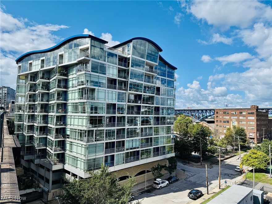 Wake up each day with the Cleveland skyline at your doorstep and the vibrant hum of the Flats just beyond your balcony. This is not just condo; it is an invitation into the heartbeat of the city. Life at Stonebridge Plaza blends modern comfort with unmatched access to the best of Cleveland's entertainment, dining, and culture, all from the comfort of a historic landmark reimagined for today's lifestyle. This two-bedroom, two-bath home offers open-concept living and dining anchored by hardwood floors, a granite and tile kitchen designed for both style and function, and spa-inspired baths that bring a touch of luxury to your daily routine. The private balcony extends your living space outdoors, creating the perfect spot to enjoy your morning coffee or take in the sparling lights of the city after dark. Stonebridge Plaza offers residents more than a place to call home. It delivers a lifestyle. Concierge and security services provide peace of mind, while two fitness centers including a cardio room on the sixth floor and a weight room on the fifth, bring convenience to your daily wellness routine. A private bridge connects you to Superior Viaduct Park, where sweeping views of the city skyline create an unforgettable backdrop for walks and sunsets. Outside your front door the Flats awaits. Catch a concert a Jacobs Pavilion, spend the day exploring the Greater Cleveland Aquarium, laugh the night away at a comedy club, or set out on a dining cruise along the Cuyahoga River. Water Taxis glide below the bridges, linking you to the East Bank and Cleveland Browns Stadium, while the city's best restaurants and nightlife are all just steps away.