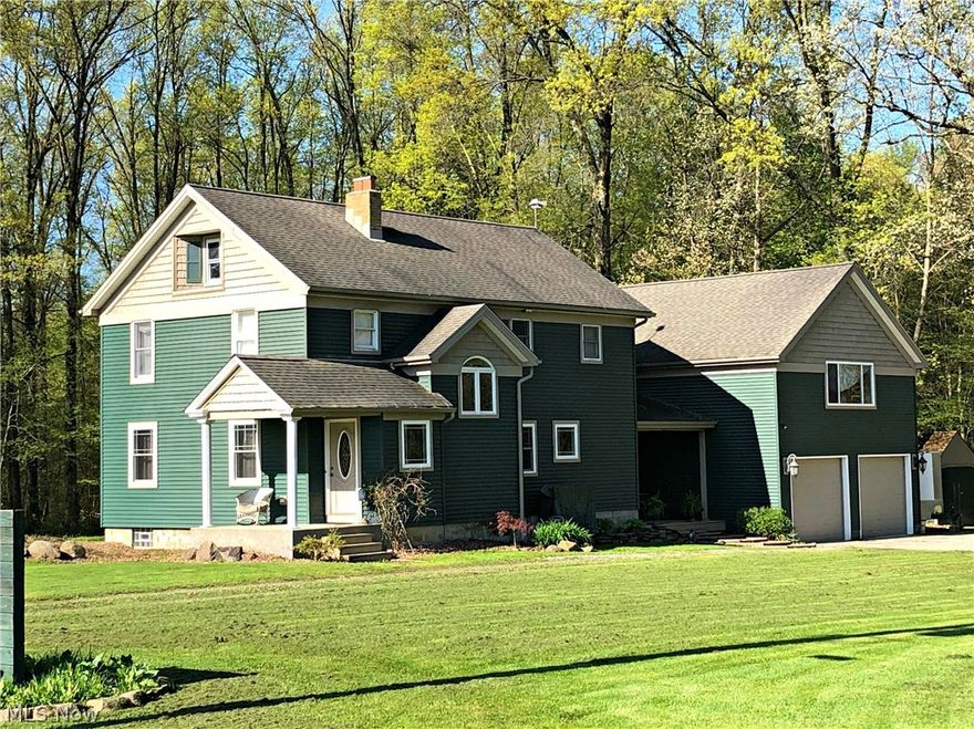 This home was professionally and completely remodeled from top to bottom in 2006! It has a new roof and top quality vinyl siding, new electrical, plumbing, insulation, windows, drywall, ceramic tile, carpet and hardwood flooring. The furnace, ductwork and  heatpump were also replaced in 2006, along with all the appliances. The master bedroom boasts a luxurious en- suite bathroom with jacuzzi tub and spacious 7'x10' walk-in closet. The partially finished basement features a Nature Stone Floor* and beautiful high-efficiency wood stove, newer block walls and glass block windows. The walk-up attic is unfinished and great for storage but could become living space. The extra deep 2 car garage features a full second story boasting 900 sq ft of space with high ceilings, it is wired and ready to become  office or workshop space. The large, comfortable covered deck is perfect for outside entertaining. The well and septic have been inspected by the Mahoning County Health Dept. and have passed. Th