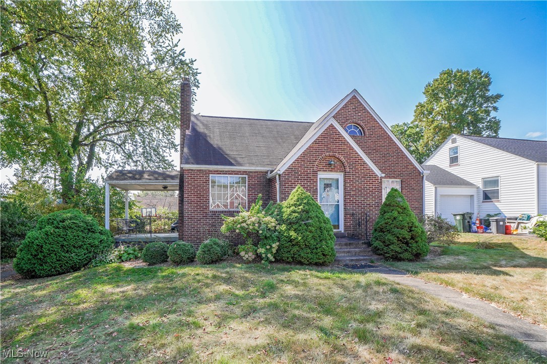Impressive brick bungalow featuring 2,379 square feet that includes a full in-law suite. Step inside to find arched doorways, a cozy fireplace, and hardwood floors that connect the living and dining rooms. The updated kitchen is a highlight with granite countertops, a tile backsplash, and all appliances included. Two bedrooms and a full bath complete the main floor.
Upstairs offers even more space with a third bedroom featuring a vaulted ceiling, a full bath, plus a complete kitchen and sitting area with private access to the attached two car garage, perfect for guests or extended family. Outside, enjoy the covered side porch and an easy to manage yard in the desirable Market Heights neighborhood, close to shopping, dining, and the highway. Don’t miss the chance to see this rare find!