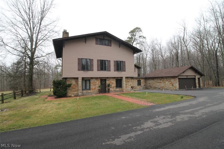 7 + ACRES!! Unique majestic home with close proximity to major highways. This very spacious four bedroom, two full and two half bath home located on 3.61 acres with an additional 3.57 acres on adjoining parcel! Kitchen just remodeled in 2014 with updated countertops, sink and faucet. There is ample cabinet and counter space, built in microwave, double wall gas oven and a gas cooktop. Fresh paint throughout the home along with replaced lighting, fans, carpet, hot water tank, electric panel, GFI'S, beautiful landscaping, and outdoor balcony. Amazing third floor remodel includes attractive flooring and updated bathroom, all completed in 2015. Repaved asphalt driveway installed in 2014. Recent first floor remodeling including the first floor den, and spacious bonus room; also included in first floor is a large laundry room with newer utility sink. First & 2nd floor Fireplaces. Garage roof was replaced in 2008. A professional home inspection has been recently performed. A two and a half car