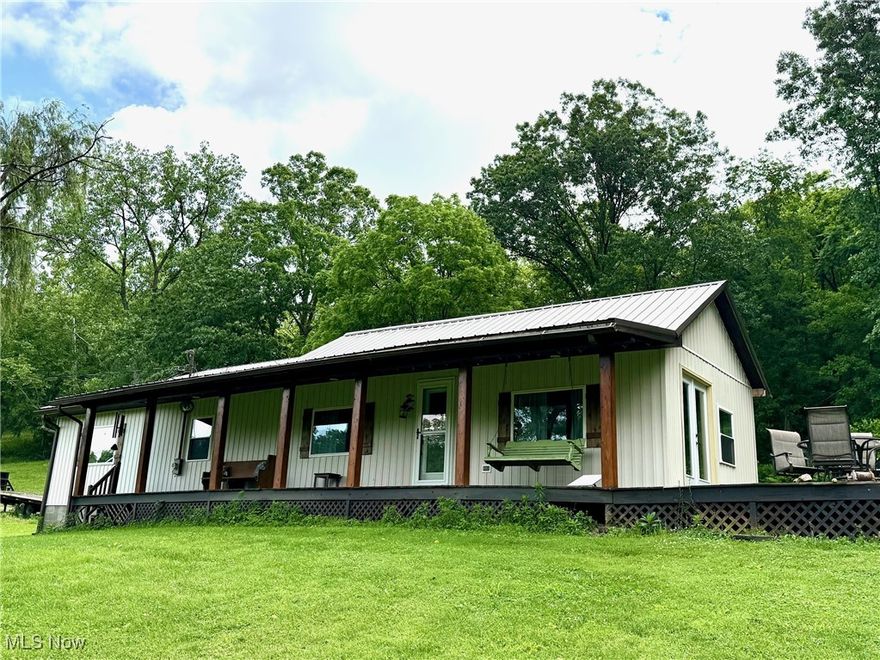 Welcome to your private retreat in Waterford!  Nestled on 17 serene acres, this beautifully maintained 3 bedroom 3 full bath home offers the perfect blend of comfort, space and functionality.  The open floor plan is the heart of the home with the updated kitchen flowing seamlessly into the dining room and great room - ideal for for everyday living and entertaining.  The cheery white kitchen features a breakfast bar, a pantry wall, stainless steel appliances and a handy pantry/open shelving area at the rear entrance.  The bright and cozy sunroom off the kitchen is perfect for relaxing with your morning coffee.  The spacious primary suite features a gorgeous full bath with a lovely tiled walk in-shower and double bowl vanity creating your own private oasis.  A new bath is nearby for the second bedroom with an additional updated bath located near the main area and third bedroom.  The conveniently located located laundry room room offers shelving for storage.  Outside enjoy peaceful mornings on the full length covered front porch or side deck.  A large two-car detached garage with a workshop area and a bath adding convenience while the 40 x 40 pole barn with 3 large garage doors provides ample storage for equipment or hobbies in addition to the potential of a business opportunity.   With partially fenced pasture and woods and a barn you could create a farm with horses or other animals.  This paradise needs to be seen to appreciate the owners attention to details including the large addition with vaulted ceilings, new windows 2021, new exterior doors 2021, new siding 2021, new kitchen 2021,  new HVAC 2023, new LVT flooring throughout and more!  Don't delay!