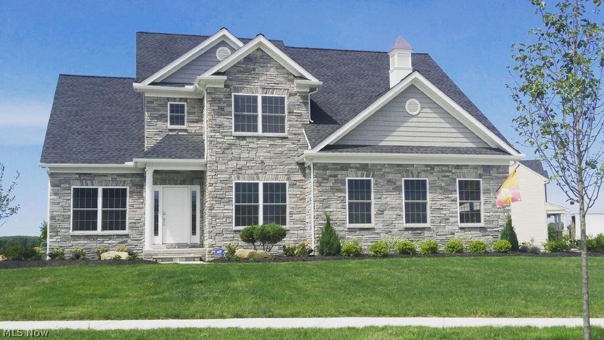 Be a part of something new and exciting! Welcome to North Ridge Pointe! This SMITEK CONSTRUCTION, CUSTOM BUILT 4 bedroom contemporary colonial is not your every day cookie cutter tract home.. and delivers all of the quality and upgrades that only custom can!  From the moment you walk through the door you will notice the beautiful details of this home.  The eat-in kitchen has granite counter tops, glass front display cabinets, a large food pantry and stainless appliances. The family room is graced with a floor to ceiling field stone fireplace and vaulted ceilings.  The office/den has built-ins, coffered ceilings with dramatic lighting and transom glass windows. The first floor owners suite has lighted tray ceilings and the bathroom with a double sink, granite topped vanity and a glass front tiled shower. On the second floor there are 3 more bedrooms with walk in closets also an amazing flex space loft with walk in storage! The full basement has been insulated and plumbed for a bathroom