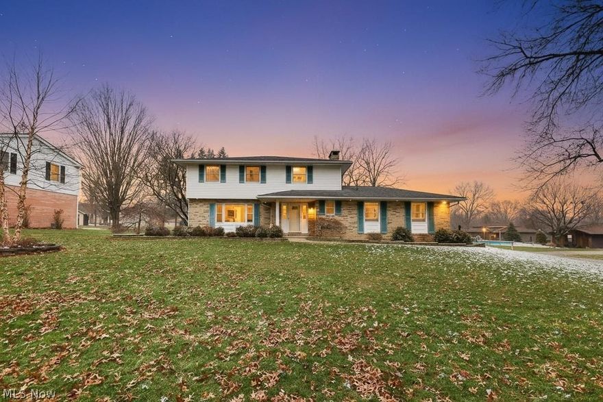 Welcome to 2761 Crompton Street — a place where comfort, space, and warmth come together beautifully. Nestled on a picturesque half-acre corner lot in North Canton, this lovingly maintained 4-bedroom, 2.5-bath colonial offers the perfect setting to put down roots and create lasting memories.
From the moment you arrive, the charming covered front porch invites you to slow down and stay awhile. Step inside to a welcoming foyer featuring a convenient half bath, a generous coat closet, and easy access to the attached 2-car garage — thoughtfully designed for everyday living.
The heart of the home is the inviting living room, where a stunning stone fireplace with a classic mantle creates a cozy focal point for quiet evenings and holiday gatherings. The spacious kitchen offers warm oak cabinetry, recessed lighting, and abundant counter space, making meal prep both functional and enjoyable. It opens effortlessly into the dining area and family room, where a large window fills the space with natural light — perfect for hosting friends or simply enjoying time together.
Upstairs, the owner’s suite provides a peaceful retreat with double closets featuring built-in shelving and a private full bath with a stand-up shower. Three additional generously sized bedrooms and a full bath offer flexibility for guests, a growing household, or a comfortable home office.
The finished lower level extends the home’s warmth and versatility with a carpeted recreation room and built-in storage — ideal for movie nights, game days, or a casual entertaining space. A dedicated workspace with shelving and extra storage makes hobbies or remote work easy and organized.
Outdoors, the brick patio with built-in seating and planters creates a welcoming space for summer barbecues or quiet mornings with coffee. A large shed with lighting and concrete flooring provides wonderful additional storage or workshop potential, and the attached garage includes shelving to keep everything neatly in place.