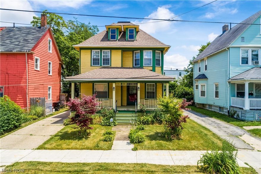 Wow! Take a look at this duplex that has been converted to one big home quite some time ago and even had some additions created to accommodate more space. You can't miss the lovely front porch which leads you into the living room boasting hardwood floors, a decorative fireplace, and flows to the formal dining room. There's a front room accessed through french doors that would be perfect for a home office. The kitchen is in the heart of the home with ceramic tile flooring, stained oak cabinetry and an exposed chimney for the classic Cleveland look. All appliances stay. In the back of the house is another living area with built-in shelving, a full bath, and there's plenty of space to create your own mudroom if desired. Access to the enclosed back porch which overlooks the garden-like backyard surrounded by a wood privacy fence. There's side door access to the home, too. Upstairs are 4 generously-sized bedrooms, one with a tandem bonus room, plus the primary bedroom has a large walk-in cl