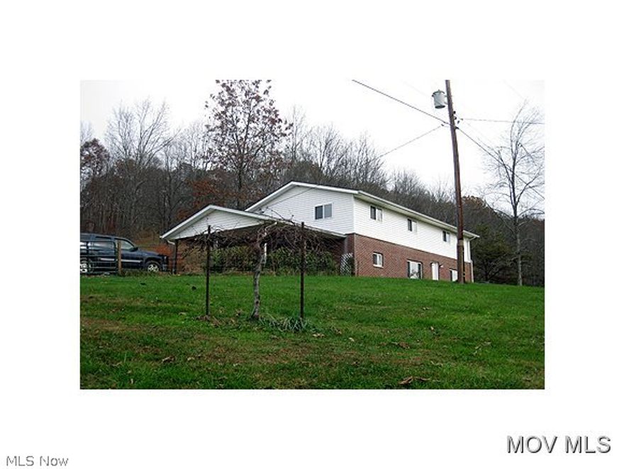 Private gated 4 BR,3 BA Country home with spacious rooms. 2 Car heated detached garage with over top workshop/office. 2 car carport. 7.69 Acres of woods, meadow, garden area, fruit trees, blueberry orchard, grape arbor, and an abundance of wildlife.One year home buyers warranty. DSL and Cell service available. Owner will consider giving $2000 back at closing with an acceptable offer to assist with closing cost.  Elem: Creed Collins Elementary Schoo  Elem/Bus: Y  JrHigh: Ritchie County Middle School  JrHigh/Bus: Y  High: Ritchie Cty. High  High/Bus: Y  Fire: VOL  Police: SHF  ;SQFT=Fin Bsmt:1104, Fin Above:1104, Fin Total:2208, Unfin Above:0;GAR= 2 Car Carport, 2 Car Det, Heated, Opener(s);PRKG= RV Parking