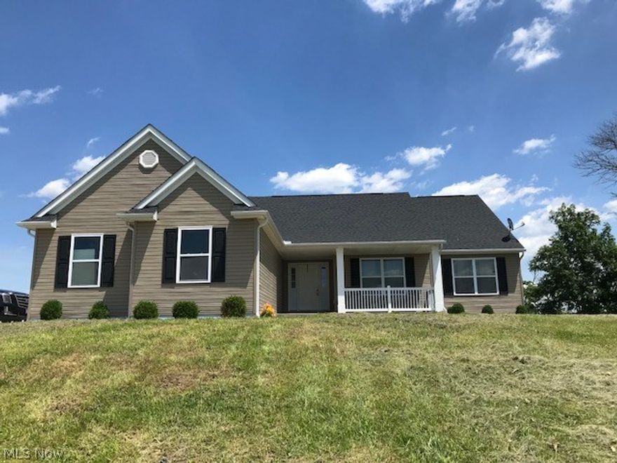 Beautiful view from the hilltop setting of this newer home with 3br. 2 full baths with extra hookup in the basement, this lovely ranch home has new flooring in the great room with cathedral ceilings and formal dining room, breakfast area off this open kitchen that's fully equipped with stainless appliances and several pantry's.  There's a first floor laundry and utility sink off the 2 car attached garage and large deck that overlooks the 5 acres it sits on.  You can finish the full walkout basement to your liking and enjoy the oversized shed for added storage for man cave.  There's a large master suite with double closets and walk in shower a the home is ready for occupancy.   Situated in EMSD