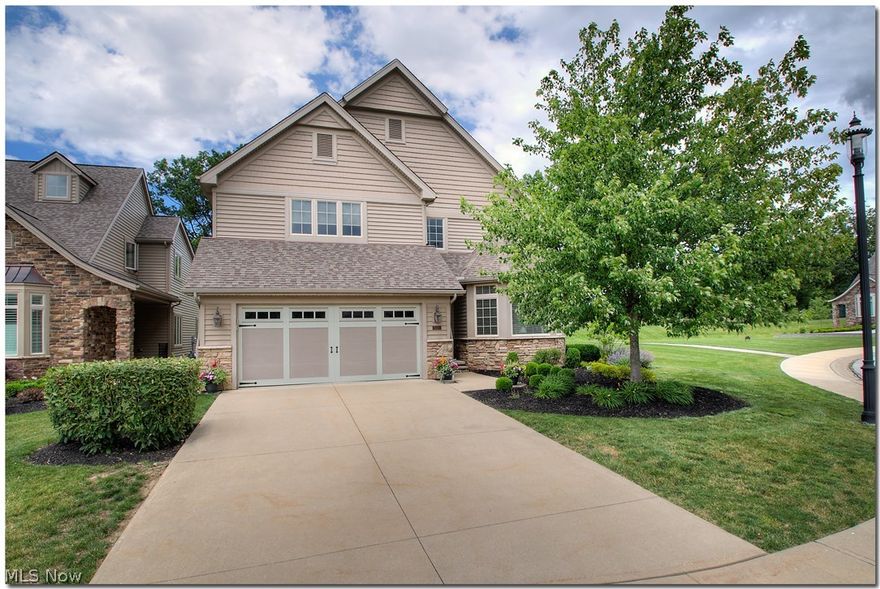 This home is better than new and is located on one of the very best lots in the subdivision.  This original owner added all the bells and whistles,including a second fireplace in the lower level family room.  The great room has walls of glass, a charming fireplace, and sliding doors that lead out to the patio and stone walkway. The landscaping and patio are breathtaking.....the perfect spot for morning coffee or a great summer read.  The master bedroom has two walk-in closets; the master bath is complete with Jacuzzi tub.  The second floor includes two bedrooms, a full bath, and an oversized loft area.  The lower level features a serving area, complete with wet bar; an art studio/office and a full bath; and a beautiful additional entertaining room, complete with fireplace.