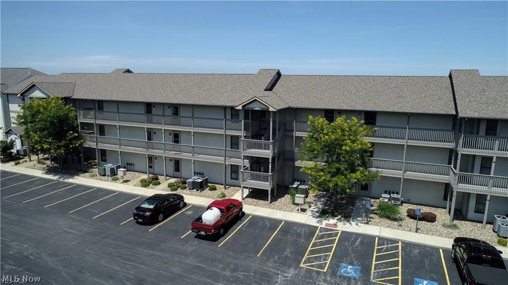 Want to wake up to beautiful sunrises and enjoy the beautiful colors of a sunset over Lake Erie everyday? Then this is the condo for you!! Located on the 3rd floor you can enjoy better Panoramic viewing of Lake Erie. Two large bedrooms with 1 full bath, 1 half bath, large living room with huge windows that overlooks Lake Erie. Also, a great covered patio area to walk out onto so you can be outside while watching the sunset or coffee in the morning. Condo also has laundry area, Large kitchen area is open concept to living room area. This condo community includes club house, in ground pool, deck/picnic areas close to beach, all are very well maintained. Just a short drive to Historic Ashtabula Harbor offering restaurants, gift shops, museums, several marinas, an Historic Lift Bridge, Ashtabula Arts Center summer theater, all within 5 to 10 minutes to the east. To the west 5 to 10 minutes Geneva On The Lake, wineries, putt putt, golf, zipline, and so much more to do. Use this condo seasonal for a great getaway or live here year round.