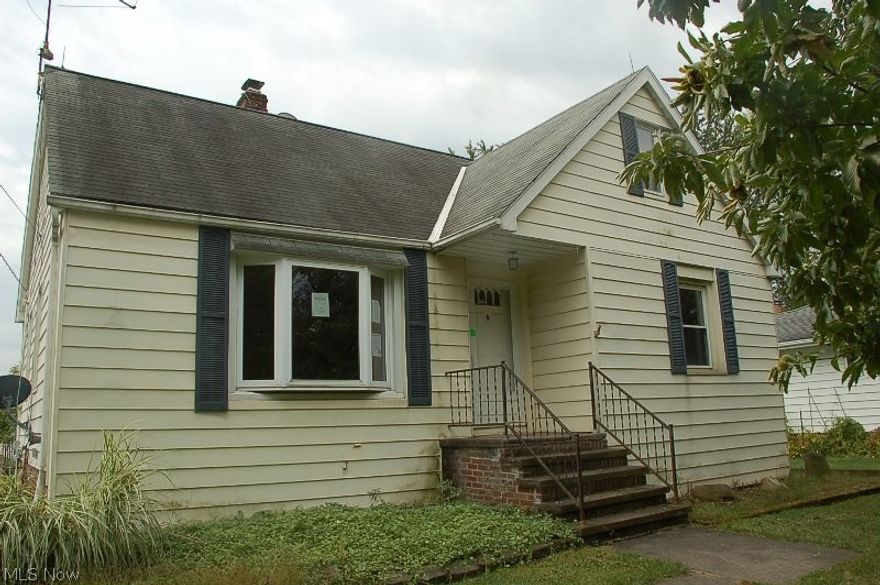 Don't miss this! Darling 4 bedroom bungalow features a dining room with laminate flooring and built ins, modern kitchen with ceramic tile flooring and dishwasher, 2 bedrooms down with full bath, 2 bedrooms up with a full bath, plus a small den on the second floor. The basement offers an updated furnace, glass block windows and plenty of storage. Enjoy entertaining in the enclosed sun room, or on the deck. Don't miss the 2 storage buildings behind the 2 car garage, these aren't sheds, they are actual buildings! Lovely yard with plenty of room for gardening, or try your hand with the existing grape arbors!