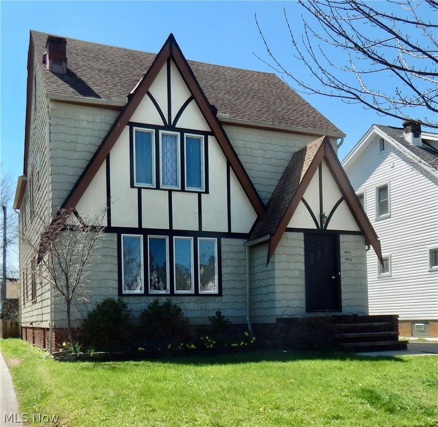 Welcome to this spacious Tudor-style duplex in the heart of Parma, one of Northeast Ohio’s most sought-after rental markets. This well-maintained property presents an outstanding opportunity for investors and owner-occupants alike, featuring long-term tenants with flexible month-to-month leases and current rents below market, offering immediate upside potential.

Each unit offers a classic, functional layout with 2 bedrooms, 1 full bath, and beautiful hardwood floors throughout. Inviting living rooms feature decorative fireplaces, while formal dining rooms include charming built-in cabinetry. The kitchens come equipped with a range and refrigerator and open to a cozy breakfast nook.

Additional features include shared basement access with laundry, a remodeled full third bathroom, and abundant storage space. Each unit also includes one space in the 2-car garage with a power door, plus a fully fenced backyard for added privacy and outdoor enjoyment.

A standout feature is the expansive third-floor attic space (over 1,100 sq ft), complete with vinyl replacement windows, electric, and its own A/C unit, offering incredible potential for additional living space or possible expansion of the upper unit.

Recent updates provide peace of mind, including two new furnaces with updated ductwork, a newer electrical panel, a newer roof, two brand-new rear decks, and freshly painted common areas.

Situated on a quiet street yet conveniently located within walking distance to shopping, dining, and everyday amenities, this property combines charm, space, and strong income potential in one exceptional package. The listing agent is related to the seller.